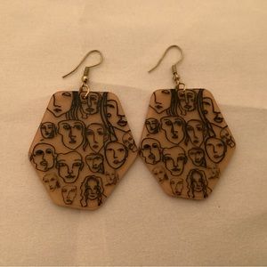 Oversized plastic dangles earrings with faces